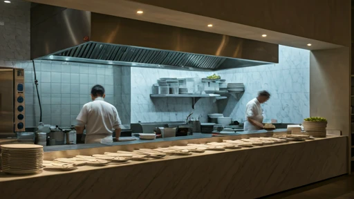 Busy modern restaurant kitchen with chefs plating food